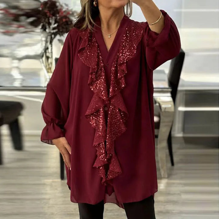 Modische Damenbluse mit Rüschen und dezenten Pailletten