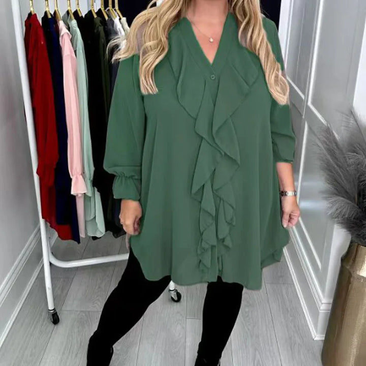 Modische Damenbluse mit Rüschen und dezenten Pailletten