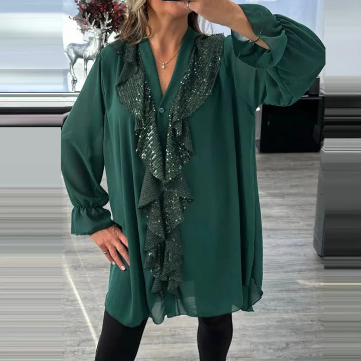 Modische Damenbluse mit Rüschen und dezenten Pailletten