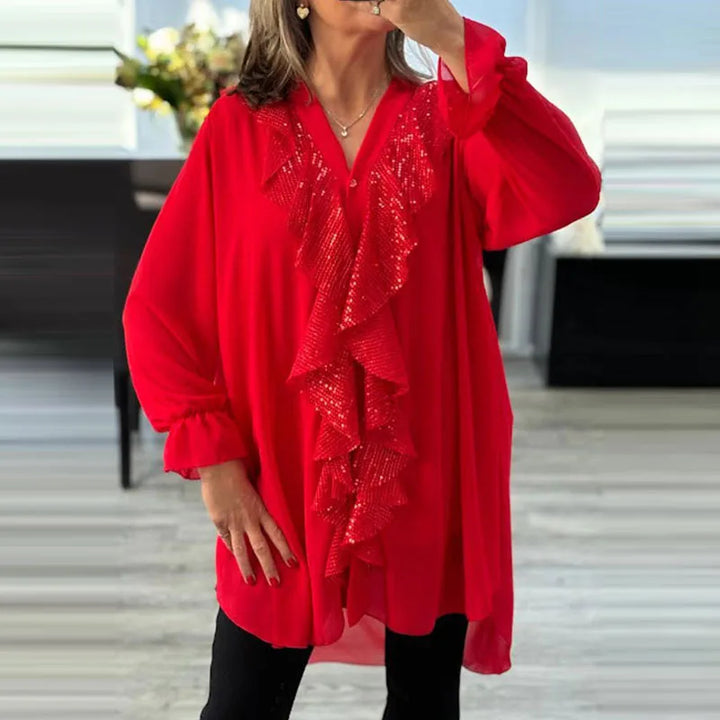 Modische Damenbluse mit Rüschen und dezenten Pailletten